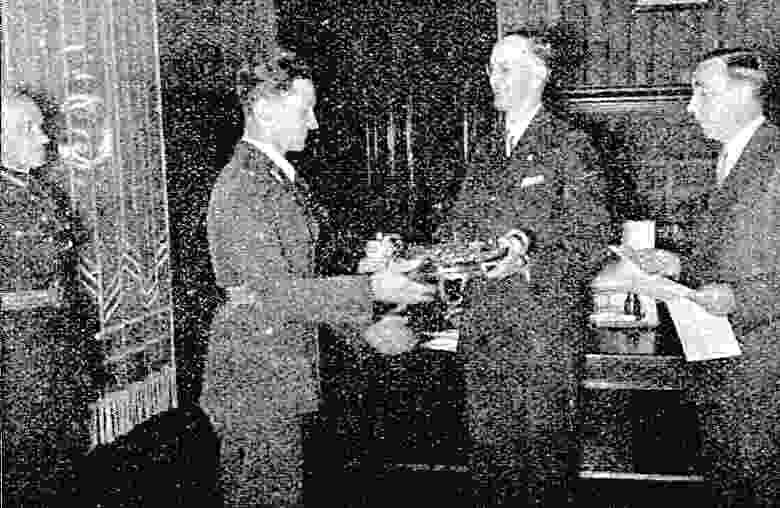 T.Gailitis receives his award
